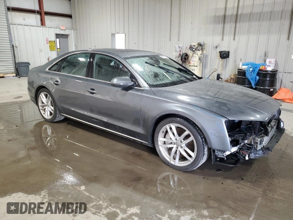 2015 Audi A8 z VIN WAUJGAFDXFN008499, wystawiony jako Copart lot #87658385 z przebiegiem 103 175 mil mil oraz Szkoda całkowita • Salvage title. Historia ofert i sprzedaży dostępna na DreamBid. Obrazek 4.