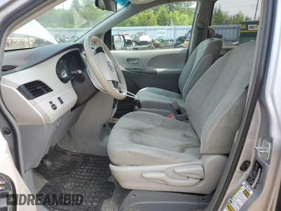 2014 Toyota Sienna L with VIN 5TDZK3DC8ES442973, listed as a Copart auction lot 59660055 with 310,496 mi miles and Salvage title. Bid and sale history available at DreamBid. Image 7.