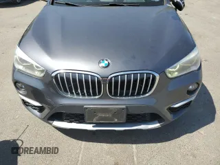 2017 BMW X1 xDrive28i z VIN WBXHT3Z37H4A54544, wystawiony jako Copart lot #55019535 z przebiegiem 76 822 mil mil oraz Szkoda całkowita • Salvage title. Historia ofert i sprzedaży dostępna na DreamBid. Obrazek 11.