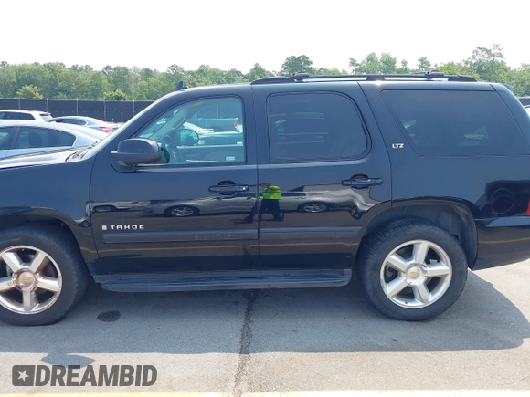 2007 Chevrolet Tahoe LTZ with VIN 1GNFC13007R111180, listed as a IAAI auction lot 42381749 with 126,472 mi miles and . Bid and sale history available at DreamBid. Image 14.