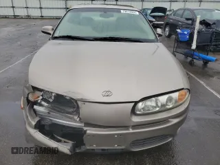 2001 Oldsmobile Aurora z VIN 1G3GR64H214292879, wystawiony jako Copart lot #79613954 z przebiegiem 88 709 mil mil oraz Szkody całkowita. Historia ofert i sprzedaży dostępna na DreamBid. Obrazek 5.