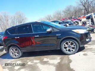 2014 Ford Escape Titanium with VIN 1FMCU0JX1EUE12260, listed as a IAAI auction lot 41826246 with 178,532 mi miles. Bid and sale history available at carsss.com. Image 12.