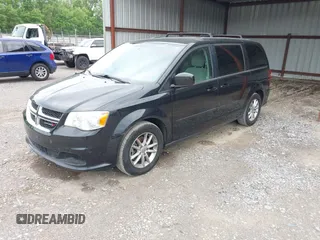 2013 Dodge Grand Caravan SXT with VIN 2C4RDGCG9DR599814, listed as a IAAI auction lot 42168424 with 173,413 mi miles and . Bid and sale history available at DreamBid. Image 2.