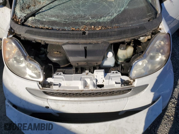 2010 Smart fortwo Pure с VIN WMEEJ3BA4AK363015, выставлен на аукционе Copart как лот 76066204 с пробегом Не указан миль и Списание • Salvage title. История ставок и продаж доступна на DreamBid. Изображение 11.