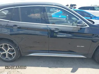 2017 BMW X1 xDrive28i with VIN WBXHT3Z30H4A65417, listed as a IAAI auction lot 42328797 with 103,788 mi miles and . Bid and sale history available at DreamBid. Image 13.