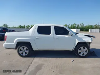2010 Honda Ridgeline RTL with VIN 5FPYK1F54AB011339, listed as a IAAI auction lot 41983918 with 201,124 mi miles. Bid and sale history available at carsss.com. Image 13.