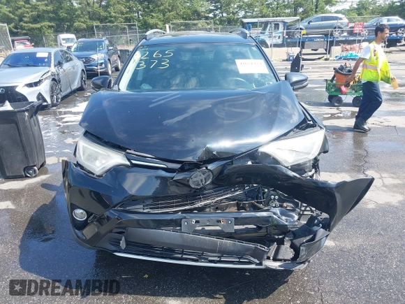 2016 Toyota RAV4 XLE with VIN 2T3RFREV9GW458057, listed as a IAAI auction lot 42651373 with 119,750 mi miles and . Bid and sale history available at DreamBid. Image 6.