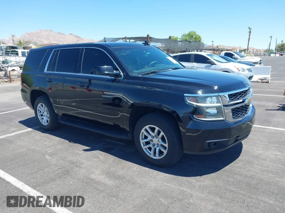 2015 Chevrolet Tahoe Commercial z VIN 1GNLC2EC0FR629983, wystawiony jako IAAI lot #42825604 z przebiegiem 112 410 mil mil oraz . Historia ofert i sprzedaży dostępna na DreamBid. Obrazek 1.