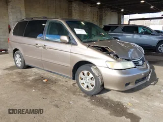 2004 Honda Odyssey EX-RES z VIN 5FNRL18874B127785, wystawiony jako IAAI lot #41141221 z przebiegiem 151 036 mil mil oraz . Historia ofert i sprzedaży dostępna na DreamBid. Obrazek 1.