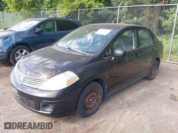 2009 Nissan Versa 1.8 S with VIN 3N1BC11E39L497791, listed as a IAAI auction lot 39679827 with 113,244 mi miles. Bid and sale history available at carsss.com. Image 2.