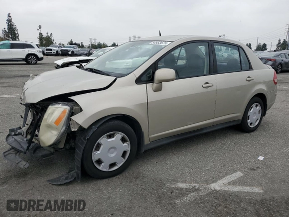2009 Nissan Versa S with VIN 3N1BC11E79L433933, listed as a Copart auction lot 54953675 with 196,785 mi miles and Salvage Title. Bid and sale history available at DreamBid. Image 1.