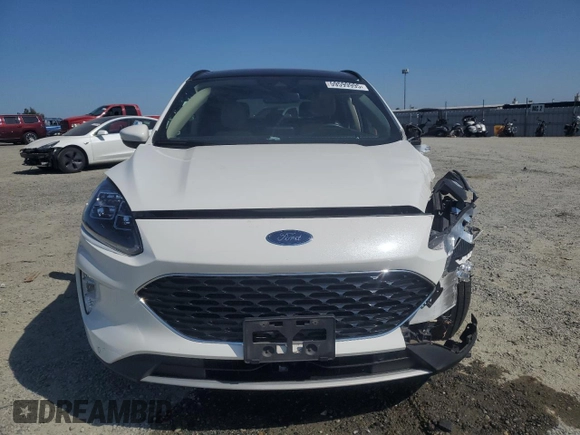 2020 Ford Escape Titanium Hybrid z VIN 1FMCU9DZ6LUC47658, wystawiony jako Copart lot #59599995 z przebiegiem 63 004 mil mil oraz Szkoda całkowita • Salvage title. Historia ofert i sprzedaży dostępna na DreamBid. Obrazek 5.