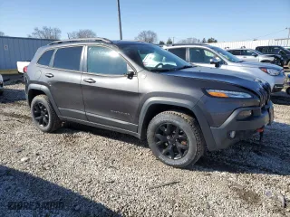 2016 Jeep Cherokee Trailhawk with VIN 1C4PJMBS7GW170588, listed as a Copart auction lot 48224535 with 55,856 mi miles and Clean Title. Bid and sale history available at carsss.com. Image 4.