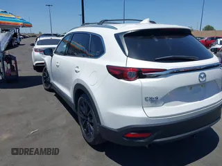 2023 Mazda CX-9 Touring Plus with VIN JM3TCBAY7P0636047, listed as a IAAI auction lot 42309618 with 20,821 mi miles and . Bid and sale history available at DreamBid. Image 3.