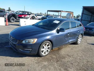 2015 Volvo V60 T5 Drive-E with VIN YV140MEJ8F1261268, listed as a IAAI auction lot 41517740 with 112,991 mi miles. Bid and sale history available at carsss.com. Image 2.