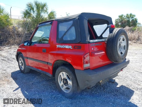 1998 Chevrolet Tracker z VIN 2CNBE1866W6924835, wystawiony jako IAAI lot #41821459 z przebiegiem 54 512 mil mil oraz . Historia ofert i sprzedaży dostępna na DreamBid. Obrazek 3.