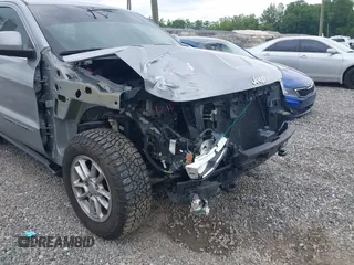 2018 Jeep Grand Cherokee Laredo E with VIN 1C4RJFAG4JC475993, listed as a IAAI auction lot 42295008 with 106,024 mi miles and . Bid and sale history available at DreamBid. Image 6.