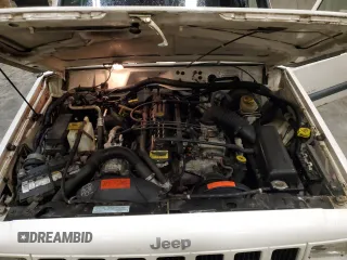 2000 Jeep Cherokee z VIN 1J4FF48S2YL104094, wystawiony jako Copart lot #57347705 z przebiegiem 75 948 mil mil oraz Nie do naprawy • Non repairable. Historia ofert i sprzedaży dostępna na DreamBid. Obrazek 11.