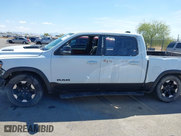 2022 Ram 1500 Rebel z VIN 1C6SRFLT4NN357352, wystawiony jako IAAI lot #41881613 z przebiegiem 31 285 mil mil oraz . Historia ofert i sprzedaży dostępna na DreamBid. Obrazek 13.