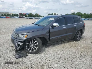 2017 Jeep Grand Cherokee Overland with VIN 1C4RJFCG1HC684826, listed as a Copart auction lot 59971595 with 101,765 mi miles and Salvage title. Bid and sale history available at DreamBid. Image 1.