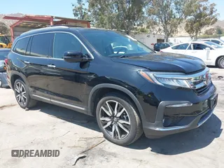 2022 Honda Pilot Touring 8-Passenger z VIN 5FNYF5H94NB004420, wystawiony jako IAAI lot #42223140 z przebiegiem 43 210 mil mil oraz . Historia ofert i sprzedaży dostępna na DreamBid. Obrazek 1.