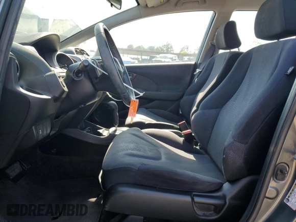 2011 Honda Fit Sport z VIN JHMGE8H5XBC002174, wystawiony jako Copart lot #52220125 z przebiegiem 161 816 mil mil oraz Szkody całkowita. Historia ofert i sprzedaży dostępna na DreamBid. Obrazek 7.
