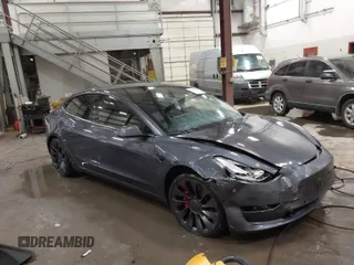 2021 Tesla Model 3 Performance with VIN 5YJ3E1EC3MF044802, listed as a IAAI auction lot 41891096 with 56,001 mi miles and . Bid and sale history available at carsss.com. Image 1.