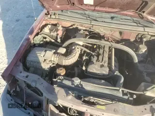 2003 Chevrolet Tracker z VIN 2CNBE13C336934957, wystawiony jako Copart lot #82918144 z przebiegiem 168 287 mil mil oraz Szkoda całkowita • Salvage title. Historia ofert i sprzedaży dostępna na DreamBid. Obrazek 16.