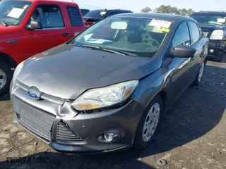 2012 Ford Focus SE with VIN 1FAHP3F29CL327580, listed as a IAAI auction lot 41882318 with 156,511 mi miles. Bid and sale history available at carsss.com. Image 2.
