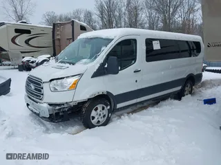 2018 Ford Transit Wagon XL with VIN 1FBZX2ZG2JKB04207, listed as a IAAI auction lot 41440996 with 126,256 mi miles. Bid and sale history available at carsss.com. Image 2.