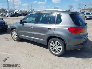 2012 Volkswagen Tiguan SE w/Sunroof & Nav with VIN WVGBV7AX4CW000207, listed as a IAAI auction lot 41889815 with 138,669 mi miles. Bid and sale history available at carsss.com. Image 3.