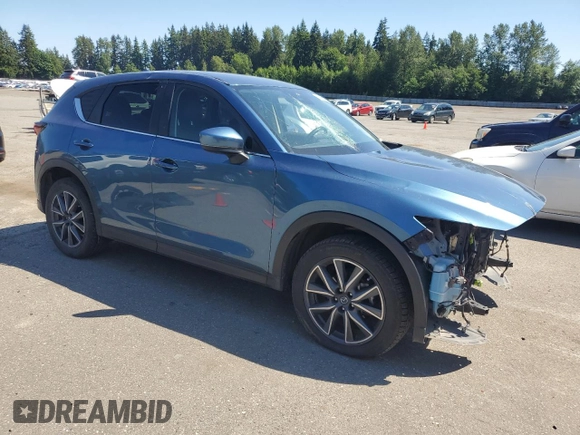 2018 Mazda CX-5 Touring z VIN JM3KFBCM2J1363310, wystawiony jako Copart lot #58969135 z przebiegiem 86 831 mil mil oraz Szkoda całkowita • Salvage title. Historia ofert i sprzedaży dostępna na DreamBid. Obrazek 4.