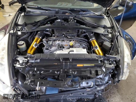 2009 Nissan 370Z z VIN JN1AZ44EX9M407193, wystawiony jako Copart lot #84891734 z przebiegiem 129 296 mil mil oraz Szkoda całkowita • Salvage title. Historia ofert i sprzedaży dostępna na DreamBid. Obrazek 11.