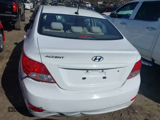 2014 Hyundai Accent GLS with VIN KMHCT4AE4EU590415, listed as a IAAI auction lot 41877817 with 169,285 mi miles. Bid and sale history available at carsss.com. Image 16.