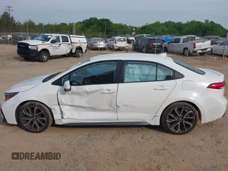 2022 Toyota Corolla SE with VIN 5YFS4MCE0NP136332, listed as a IAAI auction lot 42094001 with 36,371 mi miles and . Bid and sale history available at DreamBid. Image 14.