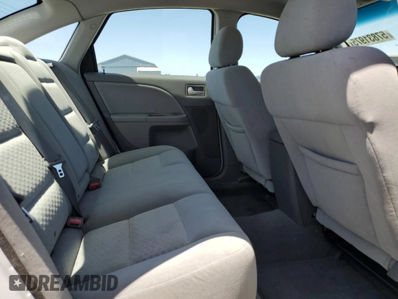 2005 Ford Five Hundred SE z VIN 1FAFP231X5G166052, wystawiony jako Copart lot #57831975 z przebiegiem 90 036 mil mil oraz Czysty tytuł • Clean title. Historia ofert i sprzedaży dostępna na DreamBid. Obrazek 10.