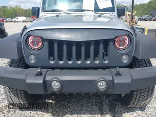 2014 Jeep Wrangler Unlimited Sport with VIN 1C4BJWDG3EL135351, listed as a IAAI auction lot 41947408 with 104,460 mi miles. Bid and sale history available at carsss.com. Image 6.
