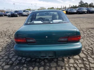 1996 Chevrolet Prizm z VIN 1Y1SK5285TZ058572, wystawiony jako Copart lot #51303845 z przebiegiem 87 109 mil mil oraz Szkoda całkowita • Salvage title. Historia ofert i sprzedaży dostępna na DreamBid. Obrazek 6.