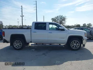 2017 GMC Sierra 1500 SLT with VIN 3GTP1NECXHG423591, listed as a IAAI auction lot 41509177 with 100,071 mi miles and . Bid and sale history available at DreamBid. Image 13.