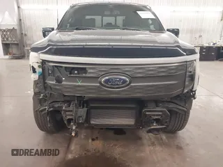 2023 Ford F-150 Lightning Pro with VIN 1FTVW1EL4PWG22900, listed as a IAAI auction lot 42139391 with 6,569 mi miles and . Bid and sale history available at DreamBid. Image 6.