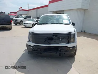2023 Ford F-150 Lightning Pro with VIN 1FTVW1EL2PWG18764, listed as a IAAI auction lot 41908278 with 16,276 mi miles and . Bid and sale history available at DreamBid. Image 12.