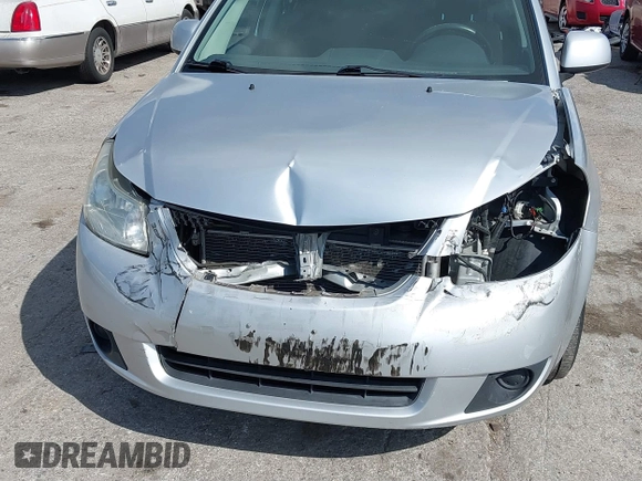 2012 Suzuki SX4 LE with VIN JS2YC5A30C6304324, listed as a IAAI auction lot 41585174 with 111,471 mi miles. Bid and sale history available at carsss.com. Image 6.