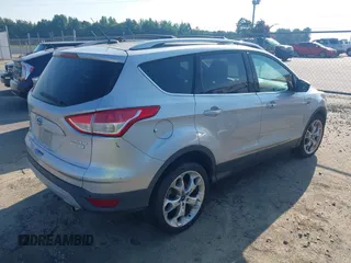 2013 Ford Escape Titanium with VIN 1FMCU0J94DUB58785, listed as a IAAI auction lot 42631897 with 163,037 mi miles and . Bid and sale history available at DreamBid. Image 4.