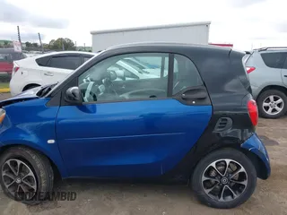 2016 Smart fortwo Passion z VIN WMEFJ5DA8GK059871, wystawiony jako IAAI lot #41624917 z przebiegiem 90 906 mil mil oraz . Historia ofert i sprzedaży dostępna na DreamBid. Obrazek 14.