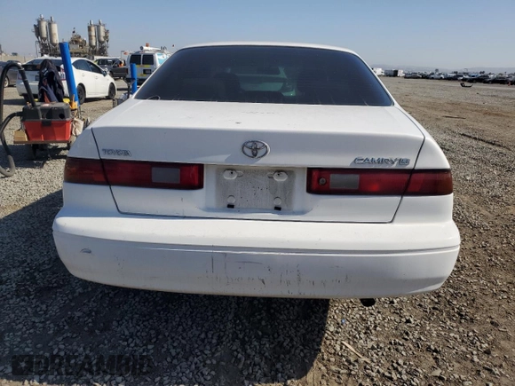 1997 Toyota Camry LE z VIN JT2BG22K4V0077954, wystawiony jako Copart lot #57682355 z przebiegiem 254 596 mil mil oraz Szkoda całkowita • Salvage title. Historia ofert i sprzedaży dostępna na DreamBid. Obrazek 6.