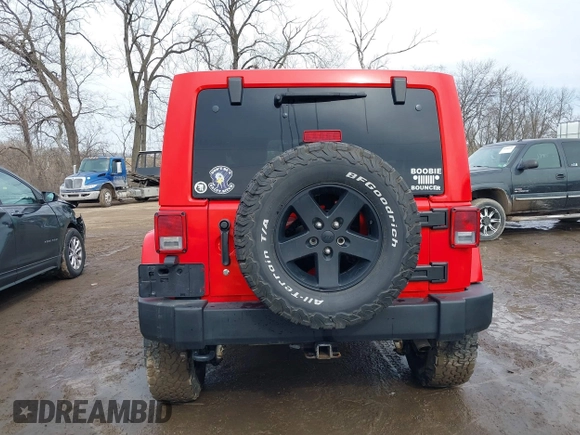 2015 Jeep Wrangler Unlimited Sahara with VIN 1C4BJWEG3FL590491, listed as a IAAI auction lot 41642219 with 148,759 mi miles. Bid and sale history available at carsss.com. Image 15.