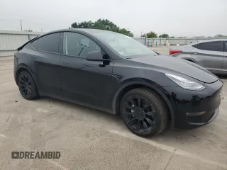 2022 Tesla Model Y Long Range with VIN 7SAYGAEE1NF381491, listed as a Copart auction lot 52694185 with 33,412 mi miles and Salvage Title. Bid and sale history available at DreamBid. Image 4.