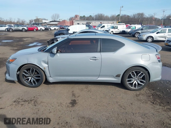 2014 Scion tC z VIN JTKJF5C71E3081033, wystawiony jako IAAI lot #41928949 z przebiegiem 144 112 mil mil oraz . Historia ofert i sprzedaży dostępna na DreamBid. Obrazek 14.
