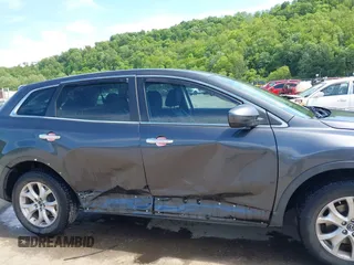 2014 Mazda CX-9 Touring with VIN JM3TB3CV9E0426767, listed as a IAAI auction lot 42301021 with 129,497 mi miles and . Bid and sale history available at DreamBid. Image 6.