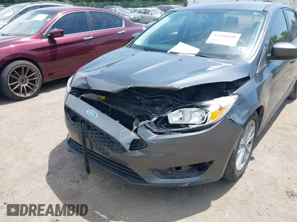 2018 Ford Focus SE with VIN 1FADP3FE2JL227679, listed as a IAAI auction lot 42296608 with 128,269 mi miles and . Bid and sale history available at DreamBid. Image 6.